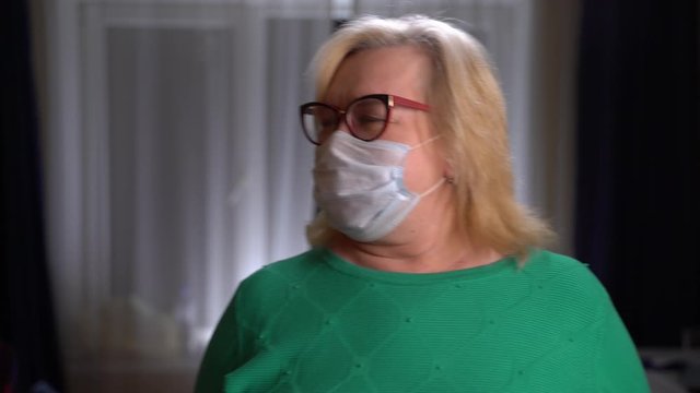 Middle Aged Woman Coughing, Face Mask At Home