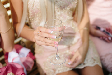 woman holding a glass of champagne