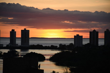Naklejka premium sunset over the river
