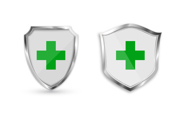 Set medical health protection shield with green cross. Protected steel guard shield concept. Security safeguard metal label. Vector illustration.