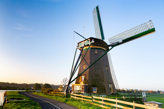 The historic Lisserpoel windmill along the river the Ringvaart in the Netherlands.