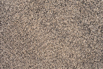 Olympia Mastic poured asphalt surface texture made by dark and bright small stones