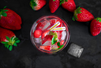 strawberry cocktail with strawberry on a black background
