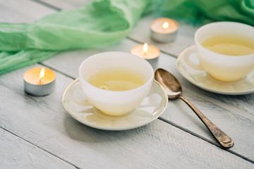 Green tea in white ceramic cups