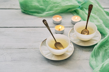 Green tea in white ceramic cups