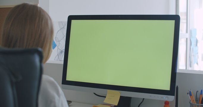 Young Woman at Home Works on Computer