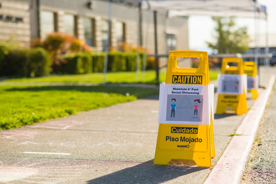 Social Distancing Curbside Sign At School