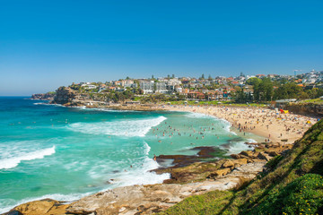 many people sunbathe and swim in the Pacific Ocean on the famous Bondi beach, Sydney, New South...