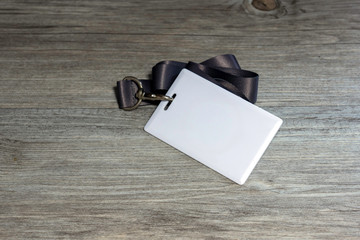 Proximity or RFID card for control security, access, protect on gray wood table.
