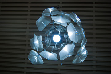 The interior design element is an original electric chandelier in the form of an exotic flower on a...