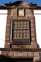Renaissance facade with door and wooden guillotine window in the historic city of La Laguna....