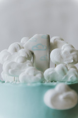 Little blue cake with the number one for the first birthday of the baby.