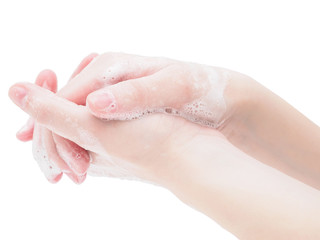 Naklejka premium Two hands in disinfectant soap foam close-up on a white background. Wash your hands with soap, be careful, and use protective equipment against coronavirus and flu. Step-by-step instructions