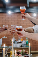 Glasses raised for a toast close-up.