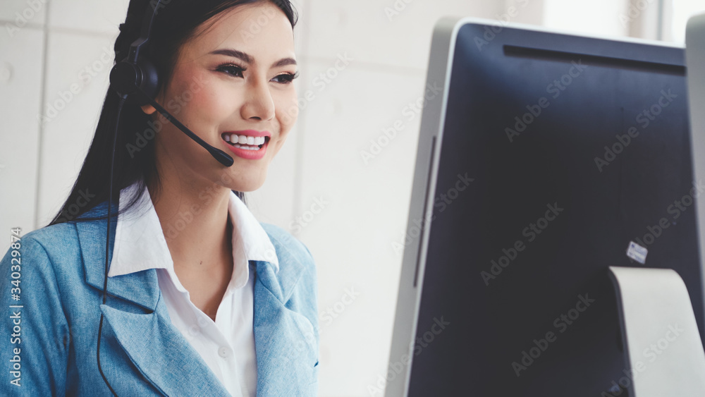 Aufkleber customer support agent or call center with headset works on desktop computer while supporting the cu