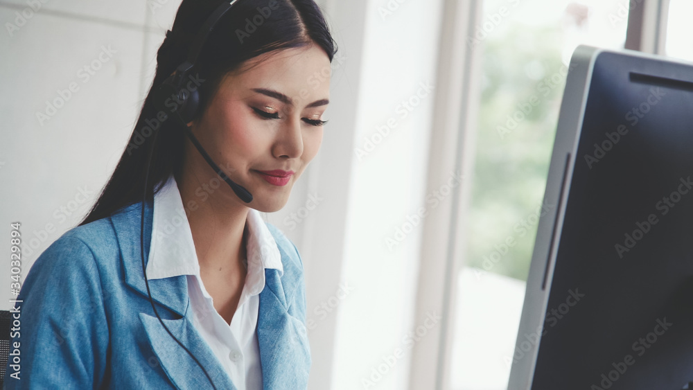 Aufkleber customer support agent or call center with headset works on desktop computer while supporting the cu