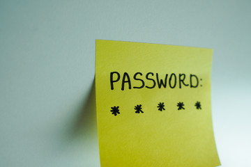Secret password written on paper note on background. Login access, encryption and cyber security...