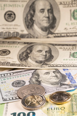 Old and new Dollar bill, one hundred Euro bill and USD coin with one and two Euro coins