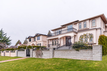 A perfect neighbourhood. Houses in suburb at Summer in the north America. Luxury houses with nice landscape. 