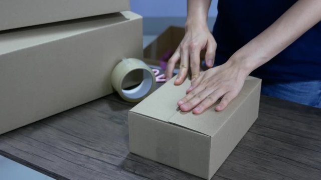 Prepare the products into the box for e-commerce online shopping delivery.