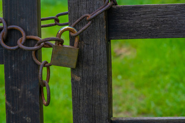 Old Rusty Chain and Padlock on Gate