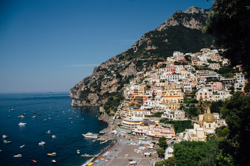 Fototapeta na wymiar Houses and hotels built on rocks in the beautiful city of Positano in Italy