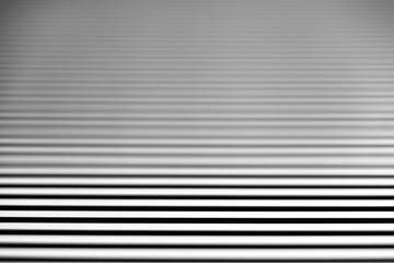 parallel alternating pattern of white and shadows