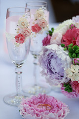 Wedding bouquet and glasses on the table