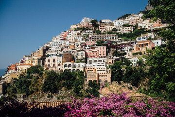 Obraz premium Houses and hotels built on rocks in the beautiful city of Positano in Italy