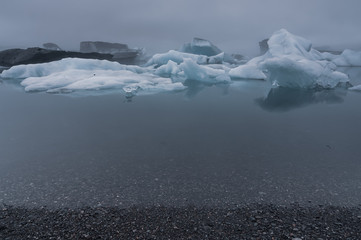 Icebergs floating on glacial lagoon lake, Iceland
