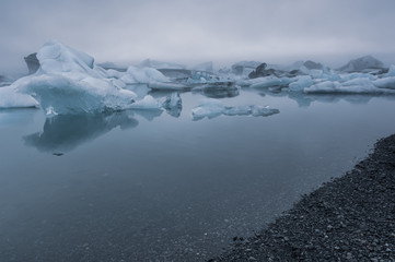 Icebergs floating on glacial lagoon lake, Iceland
