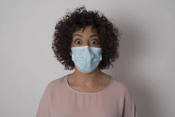 Attractive young woman having stunned and shocked look, with mouth open and jaw dropped, listening to friend's story in full disbelief, exclaiming: Wow, I can't believe this. Surprised girl. Shock