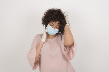 Shot of happy young woman with positive smile, has long hair, rejoices having weekend and good rest after hard working exhausting week, isolated on gray wall.