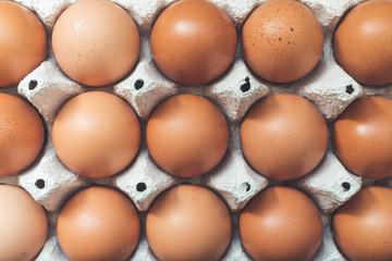 Eggs in a basket for morning breakfast or baking a cake, top view.