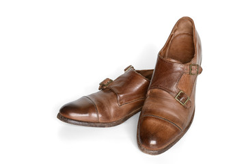 Brown leather shoes isolated on white background.