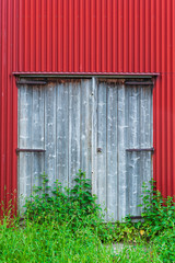 Wooden door on red barn
