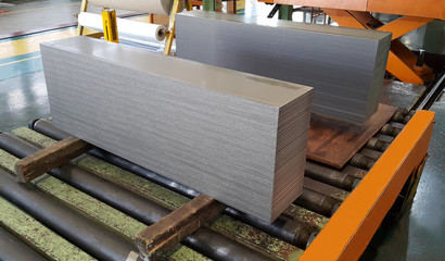Steel sheet cutting on the conveyor, sheared metal sheet industry