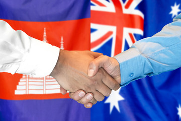 Handshake on Cambodia and Australia flag background. Support concept.