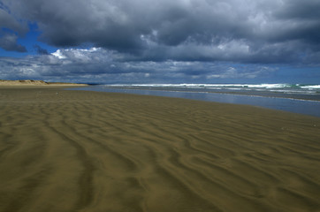 Ninety mile beach, in a cloudy day, in New Zealand
