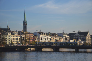 Naklejka premium Zurich and the Limmat river, grossmunster church in background