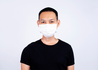 Asian man wearing mask for protect pm2.5 and Covid-19 or coronavirus for health and medical