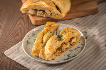 Homemade chicken pie on wooden background