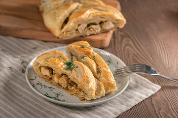 Homemade chicken pie on wooden background