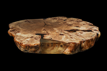 Solid elm countertop. Wood surface cross section of elm tree. Live slab. Isolated on a black. Woodworking, carpentry production. Furniture manufacture. Wooden table with epoxy resin filling.