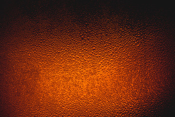 Water drops on beer background,Drops on the glass,Bottle with a cold drink 