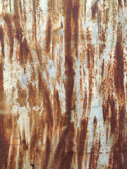 Corroded metal background. Rusty metal background with streaks of rust. Rust stains. Rystycorrosion.