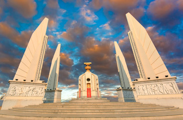 Democracy monument in the centre of Bangkok, Thailand ,sunrise with clouds, light rays and other...