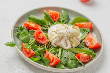 Burrata cheese. Salad with Italian burrata cheese, balsamic and cherry tomatoes.