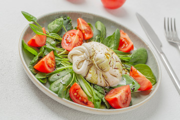 Burrata cheese. Salad with Italian burrata cheese, balsamic and cherry tomatoes.
