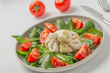 Burrata cheese. Salad with Italian burrata cheese, balsamic and cherry tomatoes.